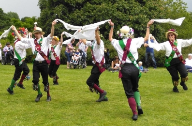 Crook dancing a Cotswold dance with waving white handkerchiefs